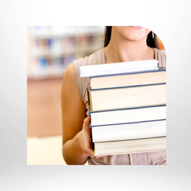 Woman holding a stack of books